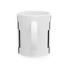 The North Mug by Pixel Threads. Ceramic mug seen from the side with the handle turned away., view 3